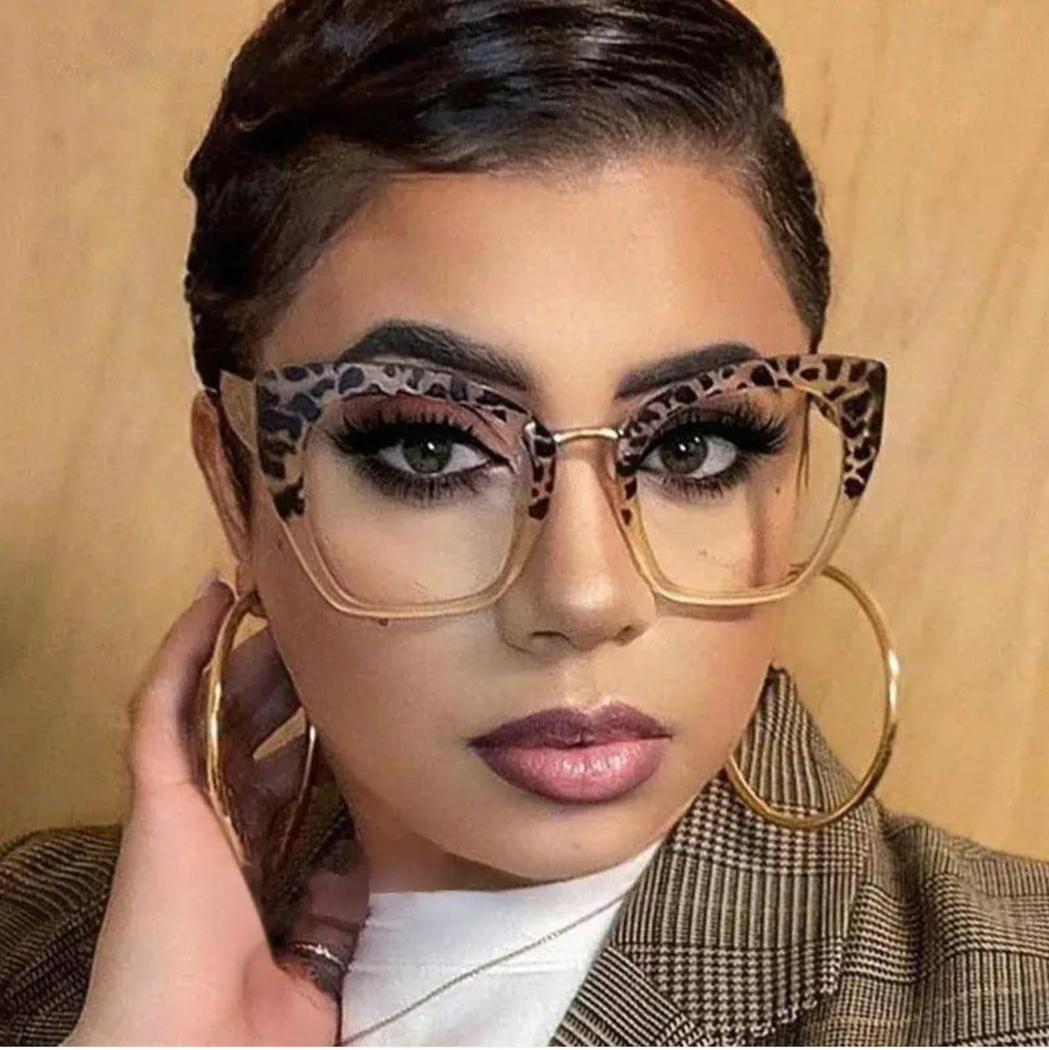 Woman wearing leopard print fashion glasses.